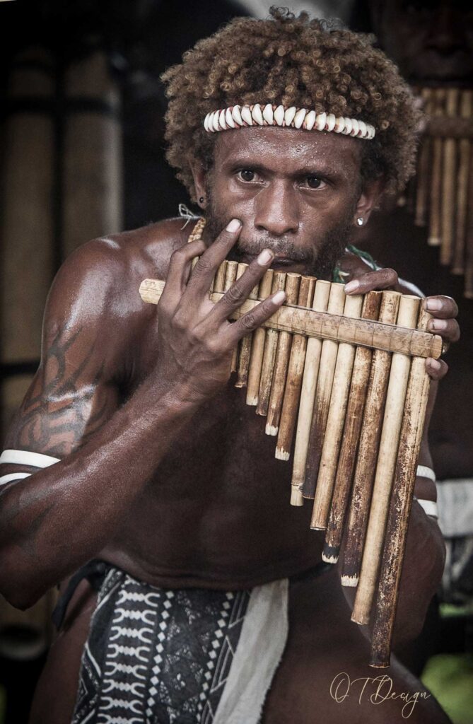 Man singing and dancing in a traditional show in Honiara, Solomon Islands