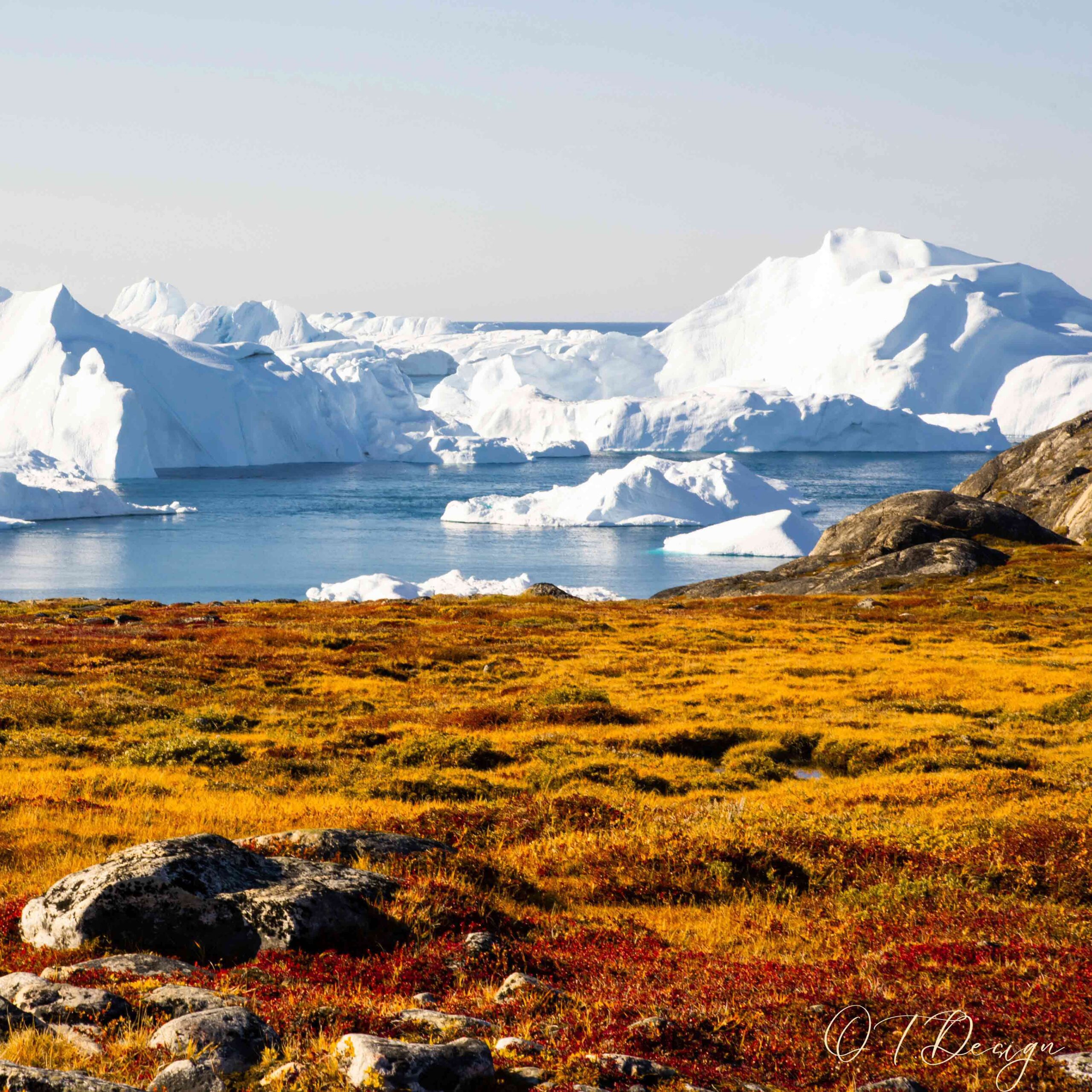 The colorful houses against the icy landscape in Ilulissat, Greenland