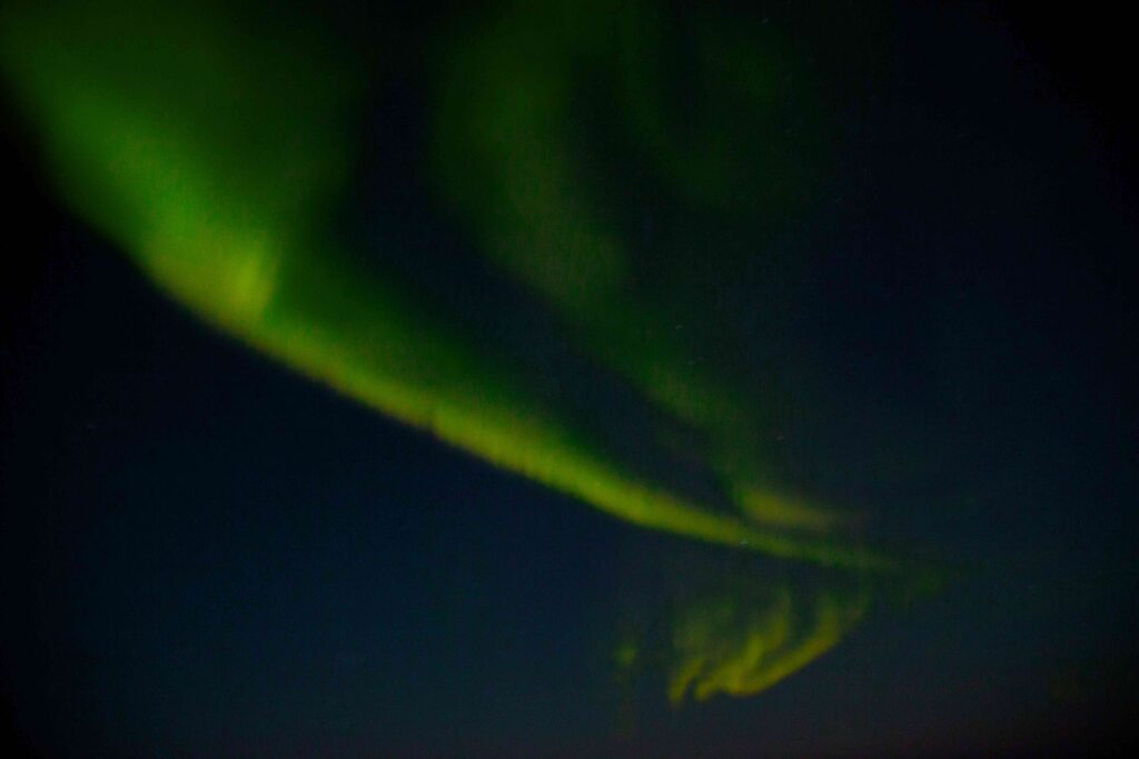 Dancing lights in the Arctic sky: A mesmerizing display of the Aurora Borealis, painting the night sky.