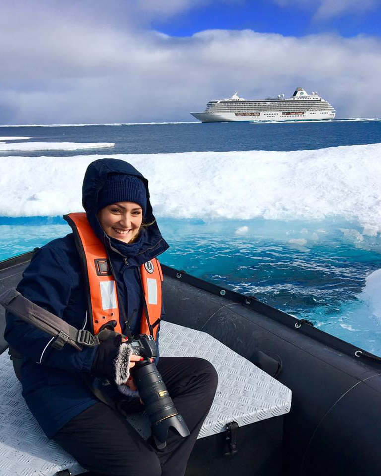 Embarking on an Arctic adventure: A captivating moment captured in a zodiac, navigating through the icy wonders, as I explore the pristine beauty of the frozen landscape.